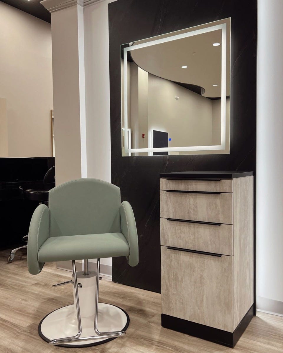 salon styling station with LED mirror, storage drawers and pale green salon chair