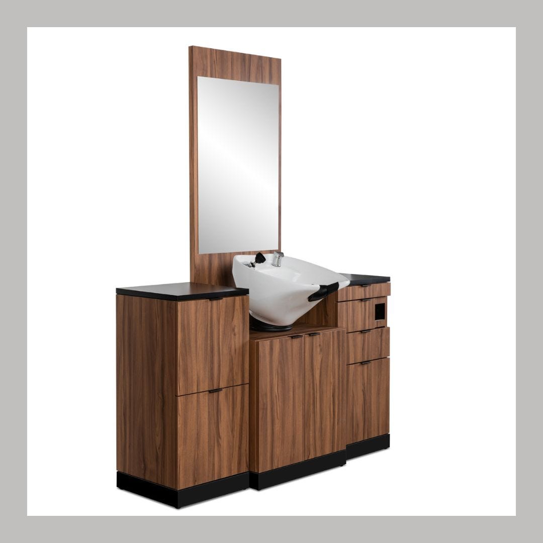 wet station with white shampoo sink, mirror, storage cabinets and drawers
