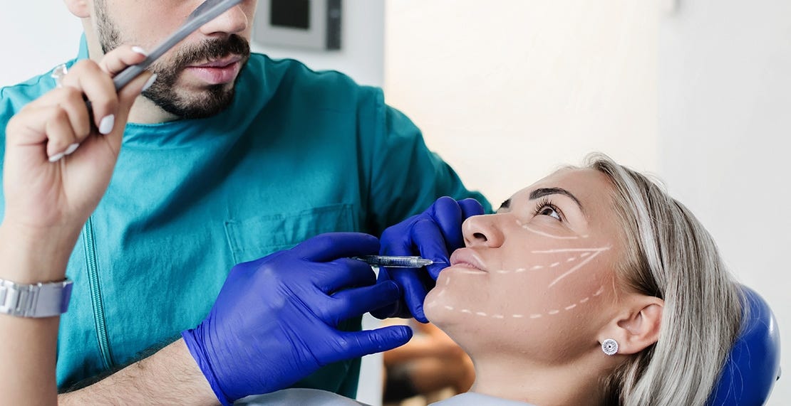 Patient receiving lip injection at a medical spa that just started