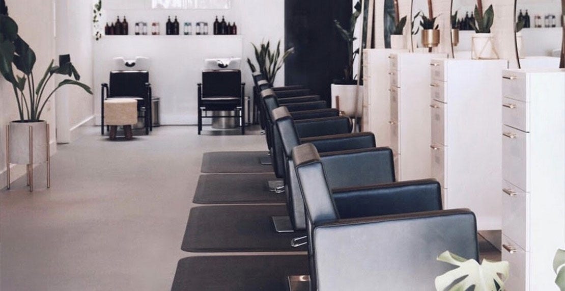 established hair salon with black and white décor